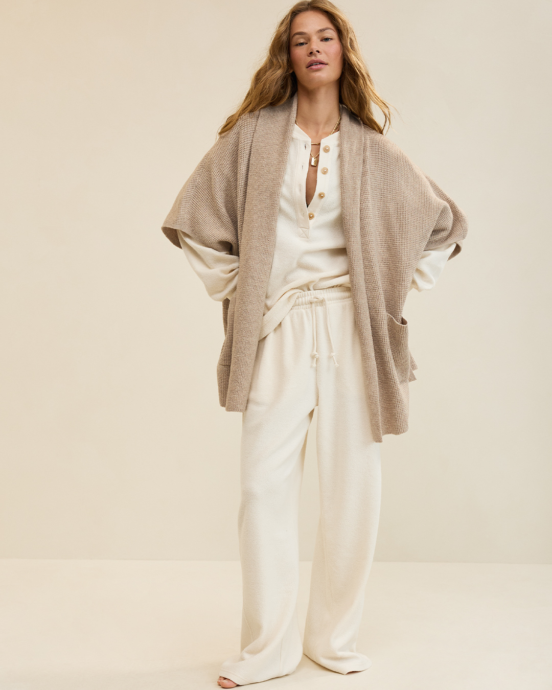 Woman layering Aerie clothing.