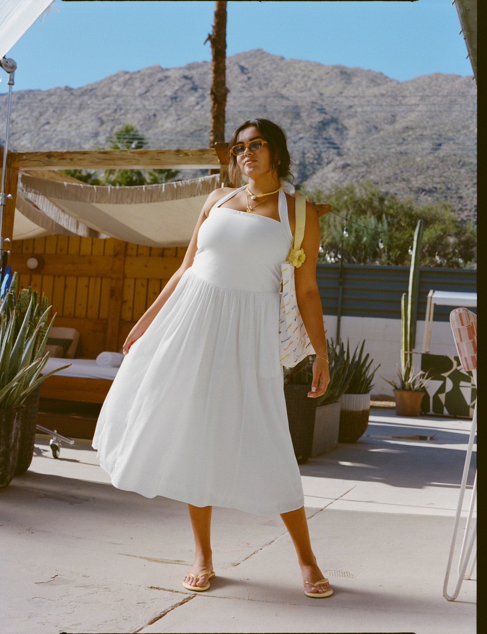 Woman wearing white Aerie maxi dress.