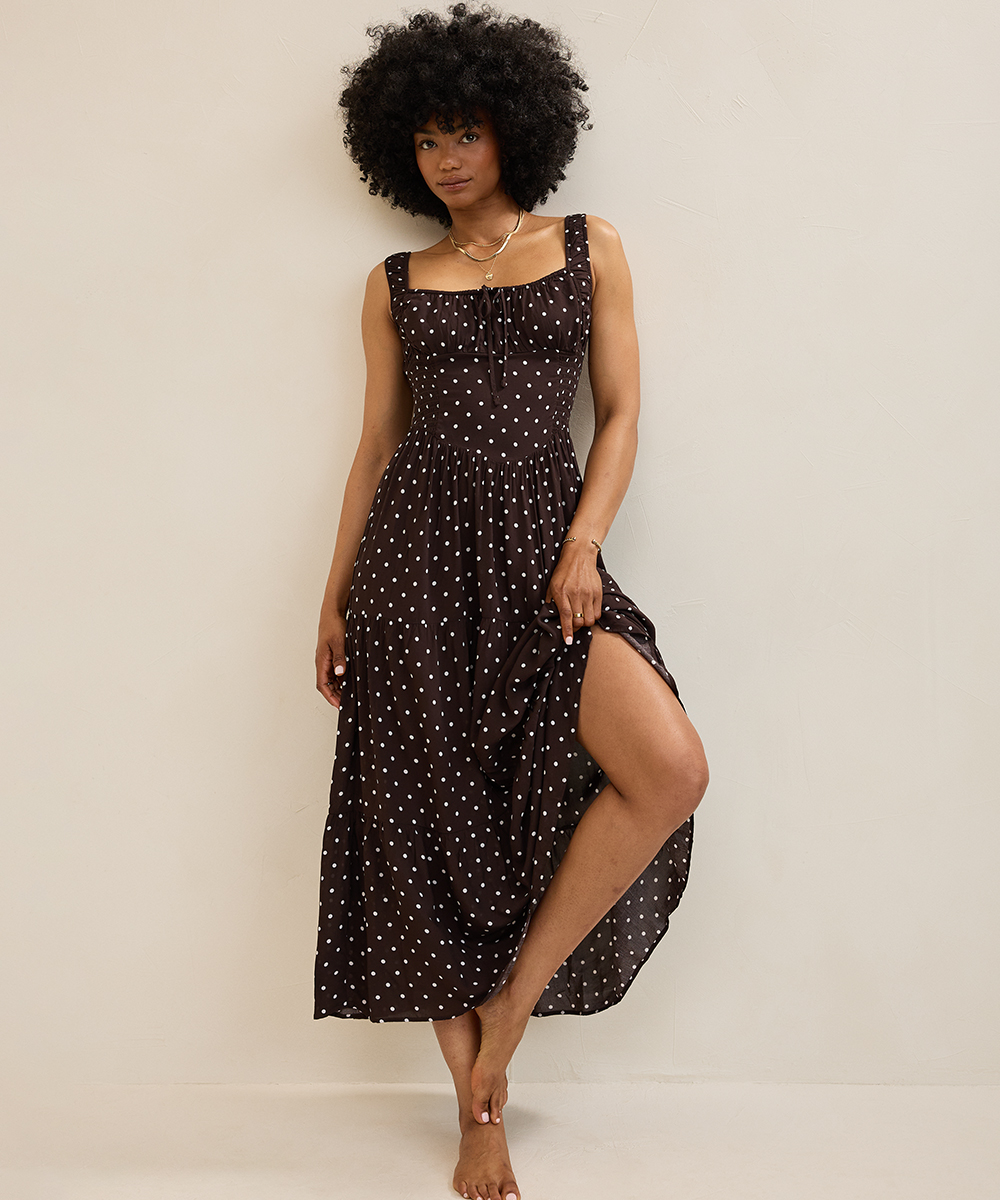 Woman in a polka dot maxi dress from Aerie.