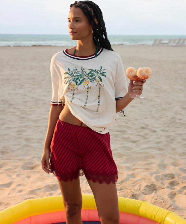 Woman in a mini skirt on the beach.