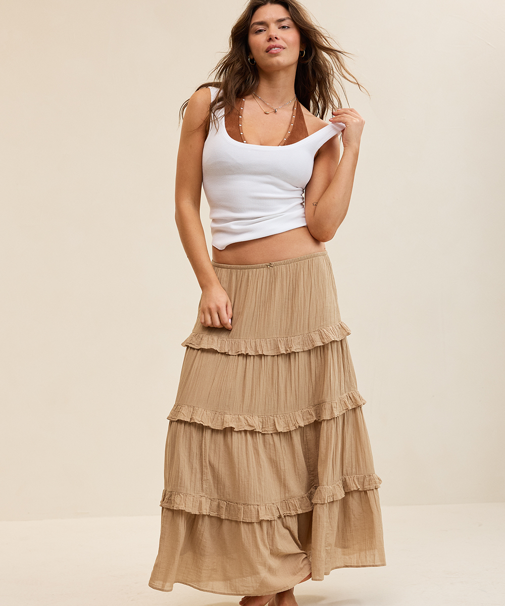 Woman wearing a brown maxi skirt.