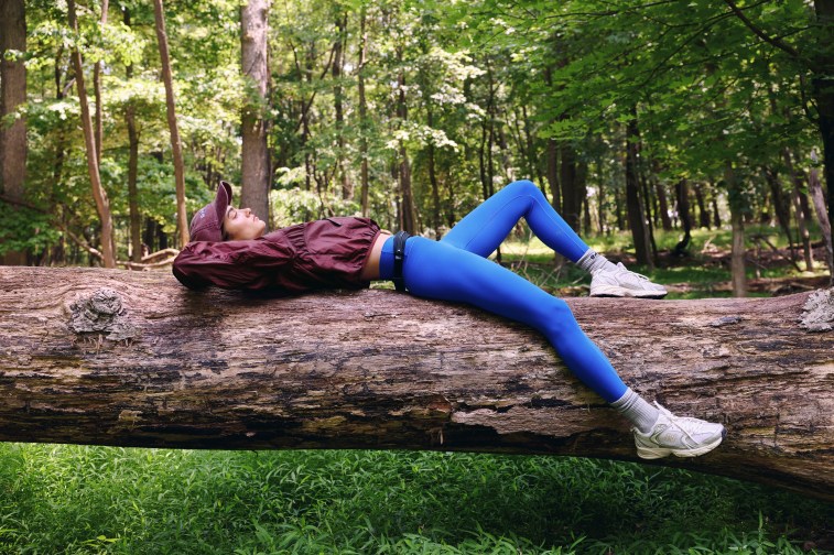 Woman wearing OFFLINE by Aerie leggings on a hike.