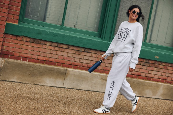 Woman wearing a Notre Dame sweat set from Aerie.