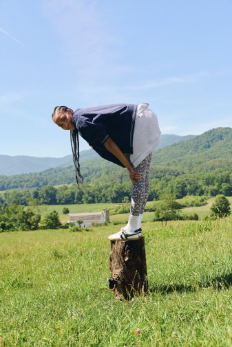 Woman stretching wearing OFFLINE by Aerie leggings.