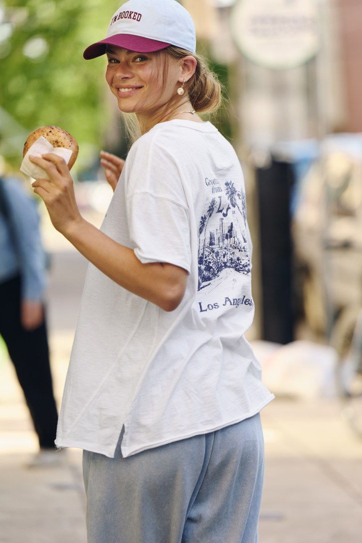 Woman wearing an oversized T-shirt. 